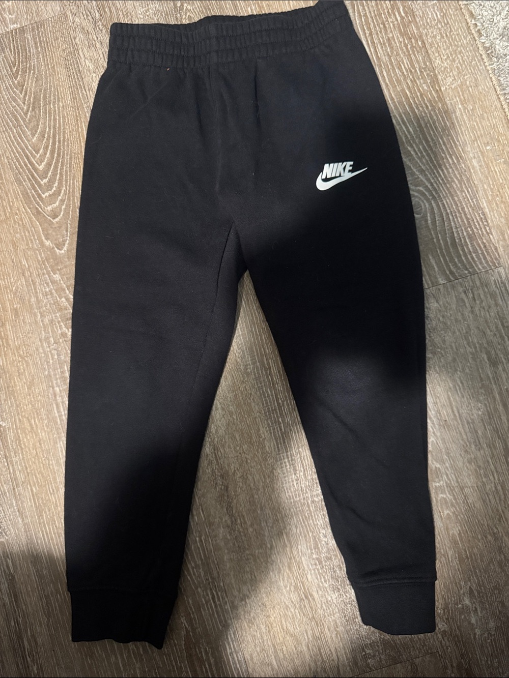 Nike Kids Black Jogger Sweatpants with White Swoosh